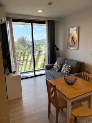 Apartment, Balcony, Golf View | Living area | Flat-screen TV