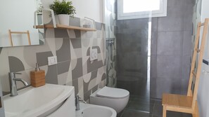 Hair dryer, bidet, towels, soap