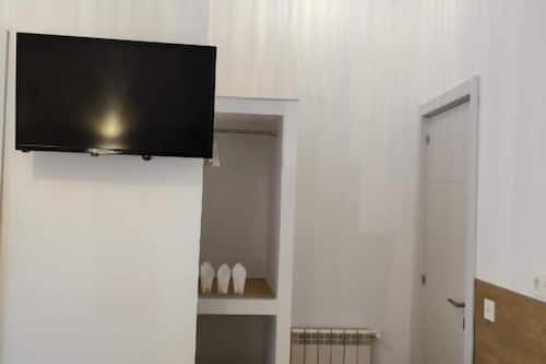 Chambre Triple, vue ville | Coin séjour