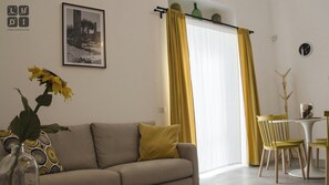Studio, 1 Queen Bed with Sofa bed, Kitchenette | Living area | 32-inch Smart TV with digital channels