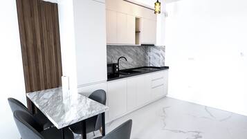 Apartment, Balcony, Partial Sea View | Private kitchen | Microwave, stovetop, electric kettle, high chair