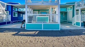 A beachfront building with a two-story balcony and a covered entrance. - Lucky Break, River Views at Roadrunner Resort (Parker)
