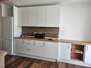 Fridge, microwave, stovetop, coffee/tea maker