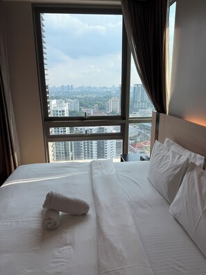 Comfort Apartment, City View | 1 bedroom, desk, laptop workspace, iron/ironing board - Swiss Garden Residences by Roomy (Kuala Lumpur)
