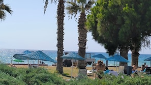 On the beach, sun loungers, beach umbrellas, 3 beach bars
