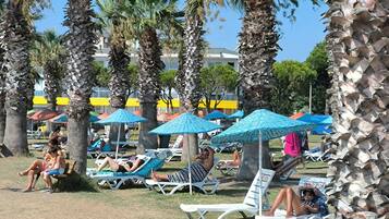 On the beach, sun-loungers, beach umbrellas, 3 beach bars