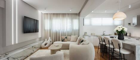 Luxury Apartment | Living area | 65-inch Smart TV with digital channels