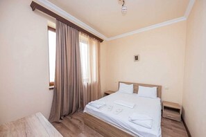 2 bedrooms, blackout curtains, iron/ironing board, free WiFi