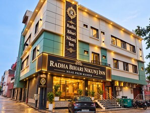 A hotel with a prominent sign indicating its name and location. - RADHA BIHARI NIKUNJ INN & RESTAURANT (Vrindavan)
