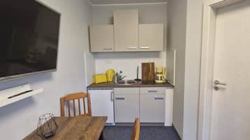 Fridge, coffee/tea maker, electric kettle, toaster