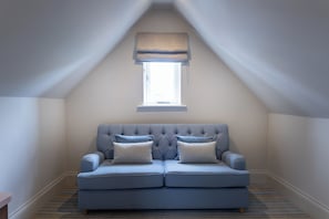 Family Suite, 1 King Bed with Sofa bed | Living area | 50-inch Smart TV with digital channels