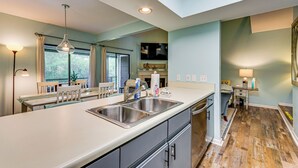 A modern kitchen with a large island, built-in appliances, and a view of the outdoors. - 7 Mi to The Wharf: Gem w/ Beach Access (Orange Beach)