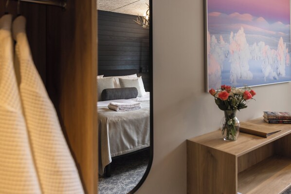 Premium bedding, laptop workspace, blackout curtains, soundproofing