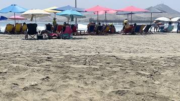 On the beach, sun-loungers