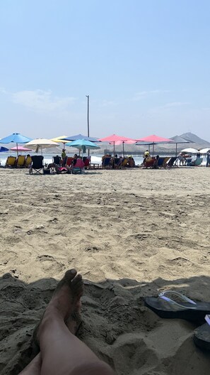 On the beach, sun loungers