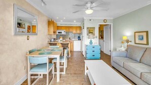 A compact living space with a dining area, kitchenette, and a sofa. - Fun Oceanfront Villa w/ Pool on Hilton Head (Hilton Head Island)