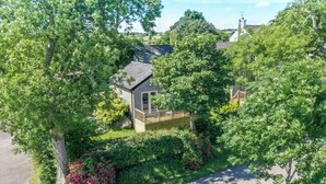 A residential property with a fenced backyard, a wooden deck, and lush greenery. - The Stables at Ballygraffan, just outside Comber in the Strangford Lough area. (Comber)
