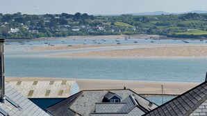A coastal town with a sandy beach, boats, and houses in the background. - "Pendennis"  Padstow -  sleeps 7 home enjoying views to the Camel Estuary (PADSTOW)