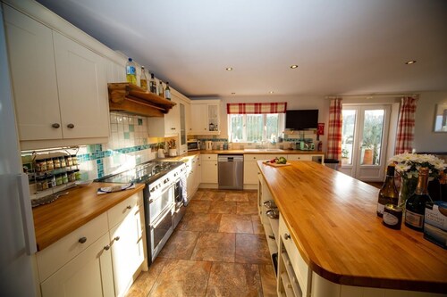 Polcarrek contemporary holiday home with parking and garden.  Balcony with rural views