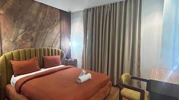 Deluxe Condo | 1 bedroom, premium bedding, pillowtop beds, iron/ironing board
