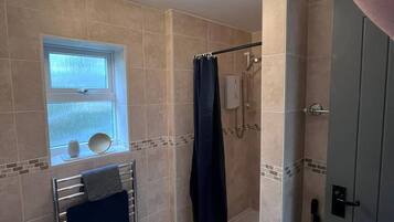 Shower, hair dryer, towels, soap