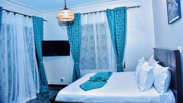 Deluxe Room, Balcony | In-room safe, desk, laptop workspace, iron/ironing board