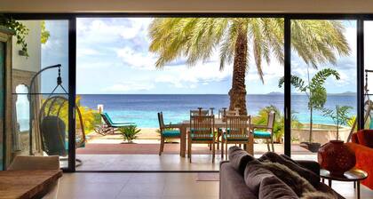 Beach House directly on azure sea