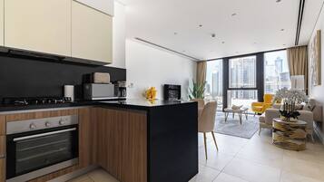 Comfort Apartment, Non Smoking, City View | Private kitchen | Full-sized fridge, microwave, oven, stovetop