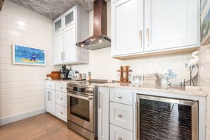 House, Multiple Beds, Patio (Palm Breeze) | Private kitchen | Fridge, microwave, oven, stovetop - Palm Breeze - Ocean Views, Golf Cart, Game Room! (Port Aransas)