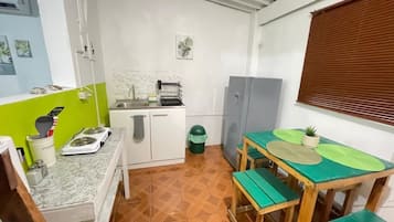 Microwave, electric kettle, cookware/dishes/utensils, dining tables
