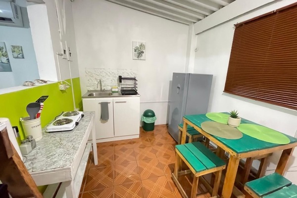 Fridge, microwave, coffee/tea maker, cookware/dishes/utensils