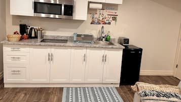 Fridge, microwave, stovetop, coffee/tea maker
