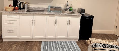 Fridge, microwave, stovetop, coffee/tea maker