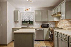 Fridge, coffee/tea maker, cookware/dishes/utensils