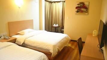 Desk, blackout drapes, iron/ironing board, bed sheets