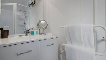 Shower, hair dryer, towels, soap