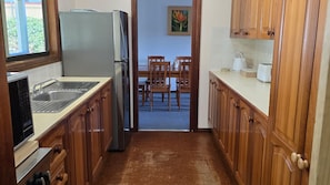 Enjoy meals and social gatherings in this well-equipped kitchen and dining area.