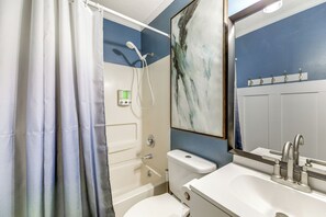 A bathroom with a shower, toilet, and sink. - Oceanfront Gem w/ Views in North Topsail Beach (North Topsail Beach)