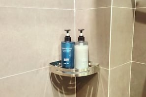 A bathroom with two toiletries on a shelf. - Film and Television Youth Hotel (Shanghai Chefeng Road) (Shanghai)