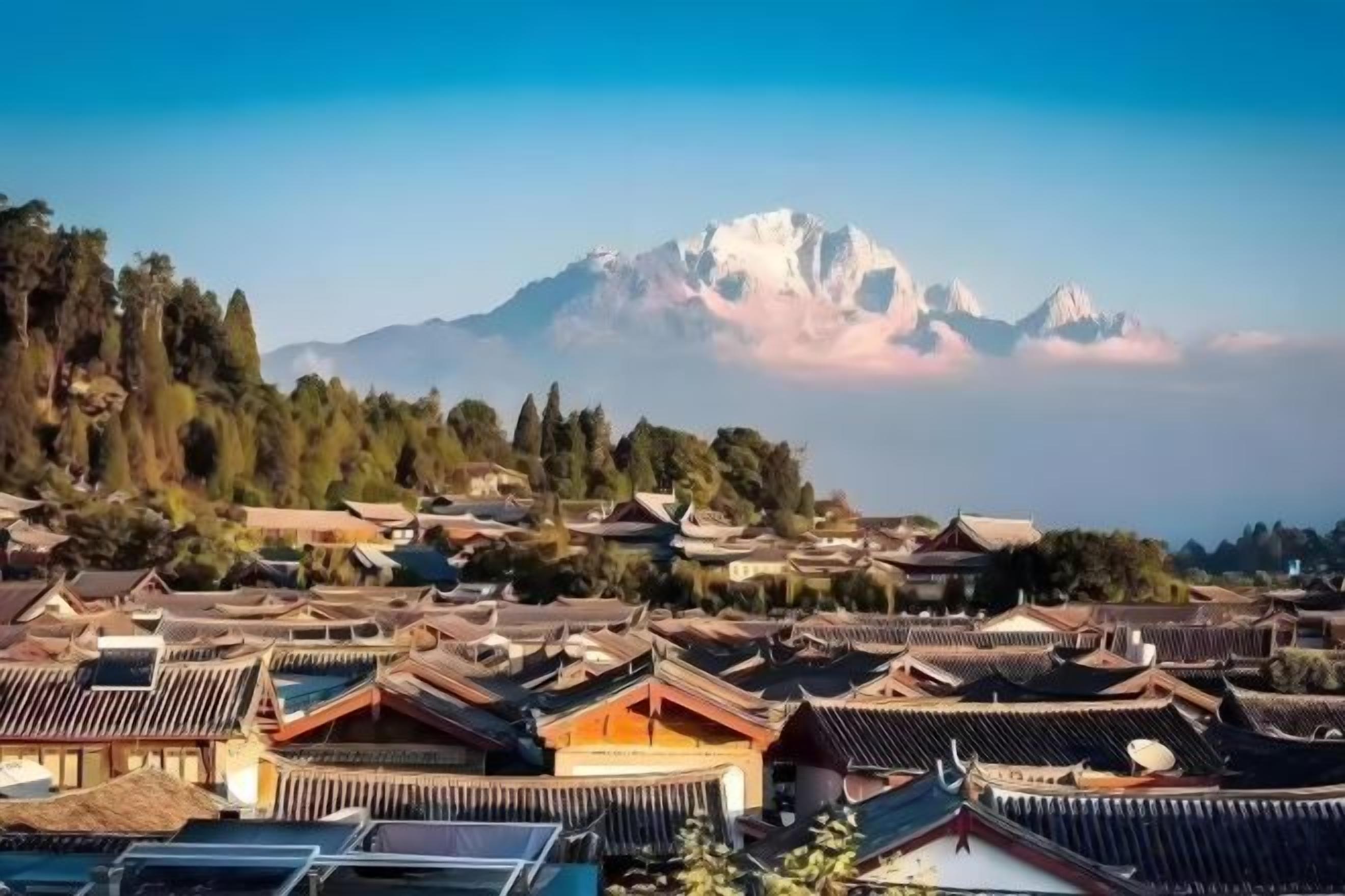 A traditional village with buildings and a mountain in the background.