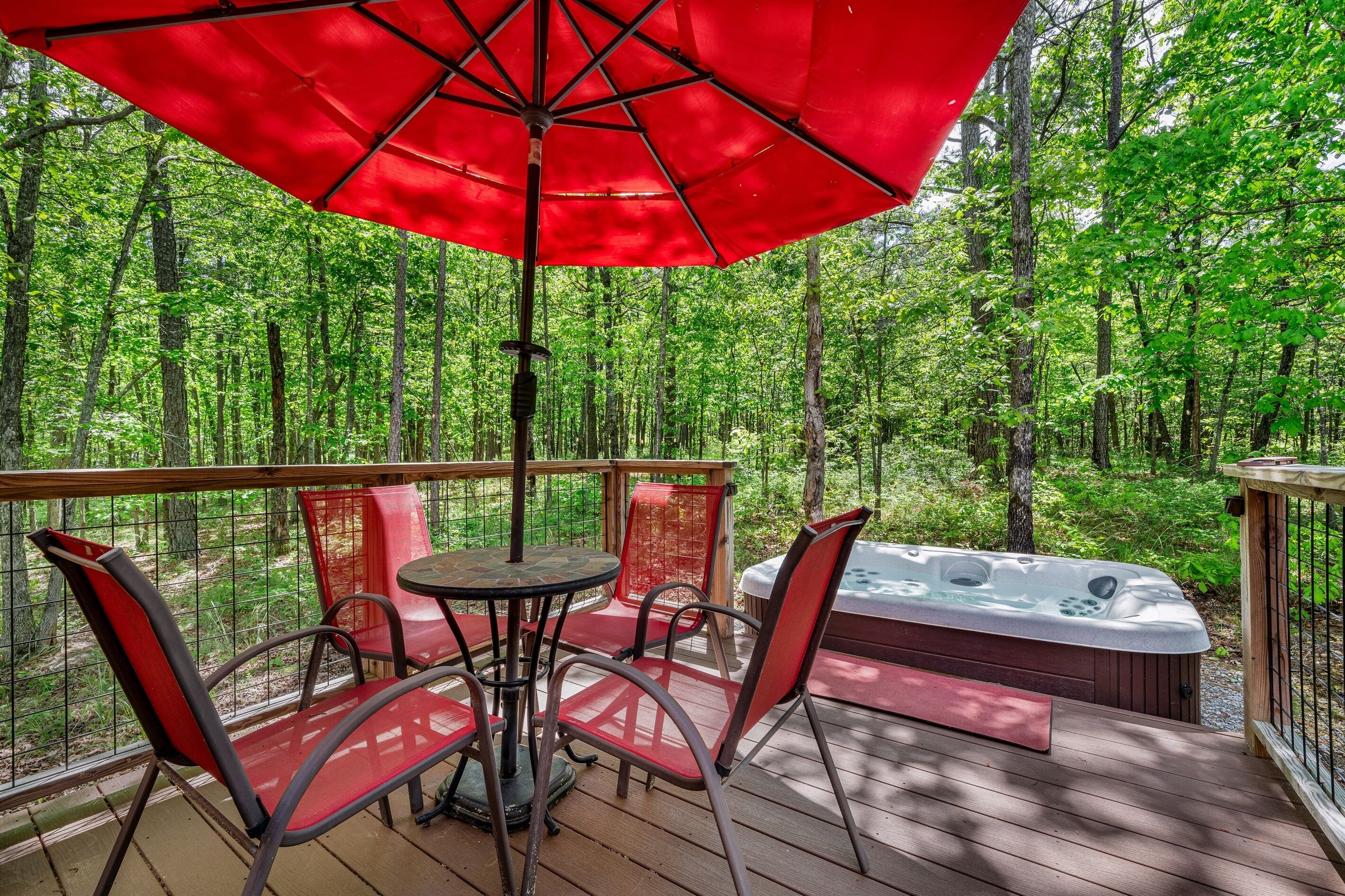 Beautiful deck with patio table and chairs….hot tub in background :)