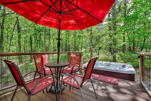 Beautiful deck with patio table and chairs….hot tub in background :)