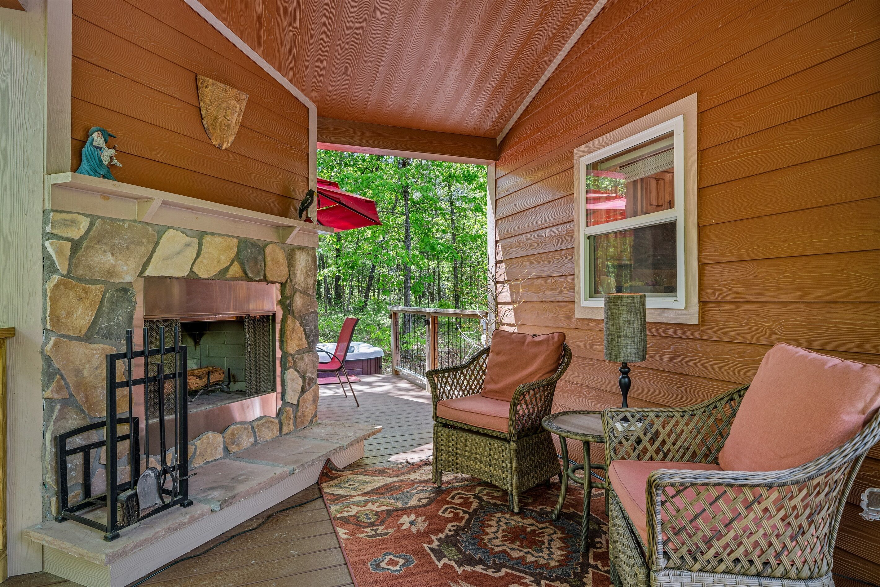 Outdoor wood fireplace on covered porch :)