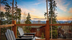 A deck with Adirondack chairs overlooking a mountainous landscape. - Silverthorne Mountain / Mountain Views, Patio & BBQ (Silverthorne)