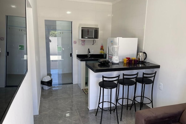 Habitación cuádruple familiar, patio | Cocina privada