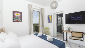 Deluxe kamer, 1 twee- of 2 eenpersoonsbedden | 1 slaapkamer, luxe beddengoed, Select Comfort-bedden, een bureau