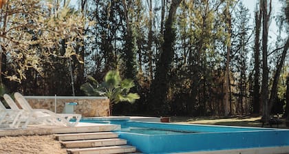 Spacious chalet with 9 bedroom,AC, WiFi, pool, 8000m2 park in Chacras de Coria