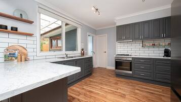 Fridge, microwave, stovetop, coffee/tea maker