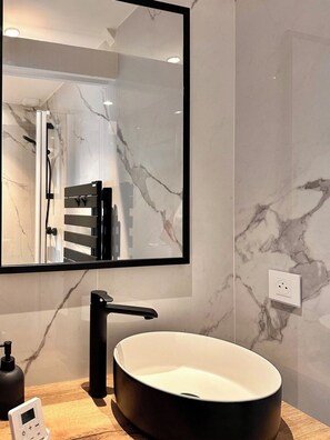 Shower, hair dryer, towels, toilet paper