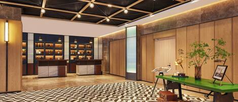 A spacious lobby with a geometric patterned floor, a reception desk, and a wooden panel wall.